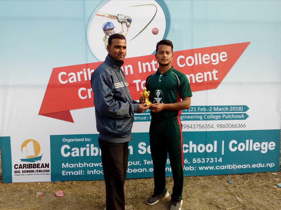 Umpire Rabindra Gupta handing over MOM trophy to Jitendra Singh Thakuri